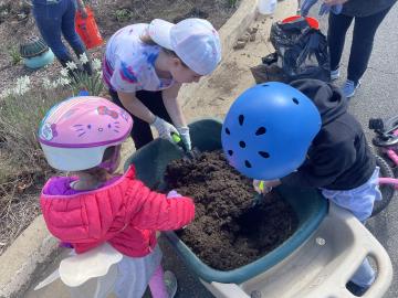 Photo of volunteers planting the pollinator garden
