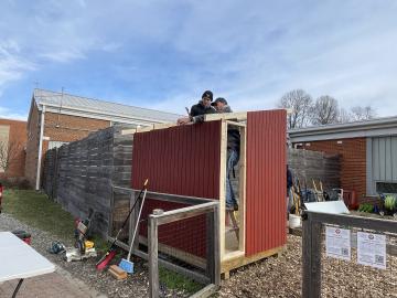 Volunteers building a garden shed
