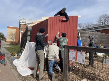 Volunteers building a garden shed